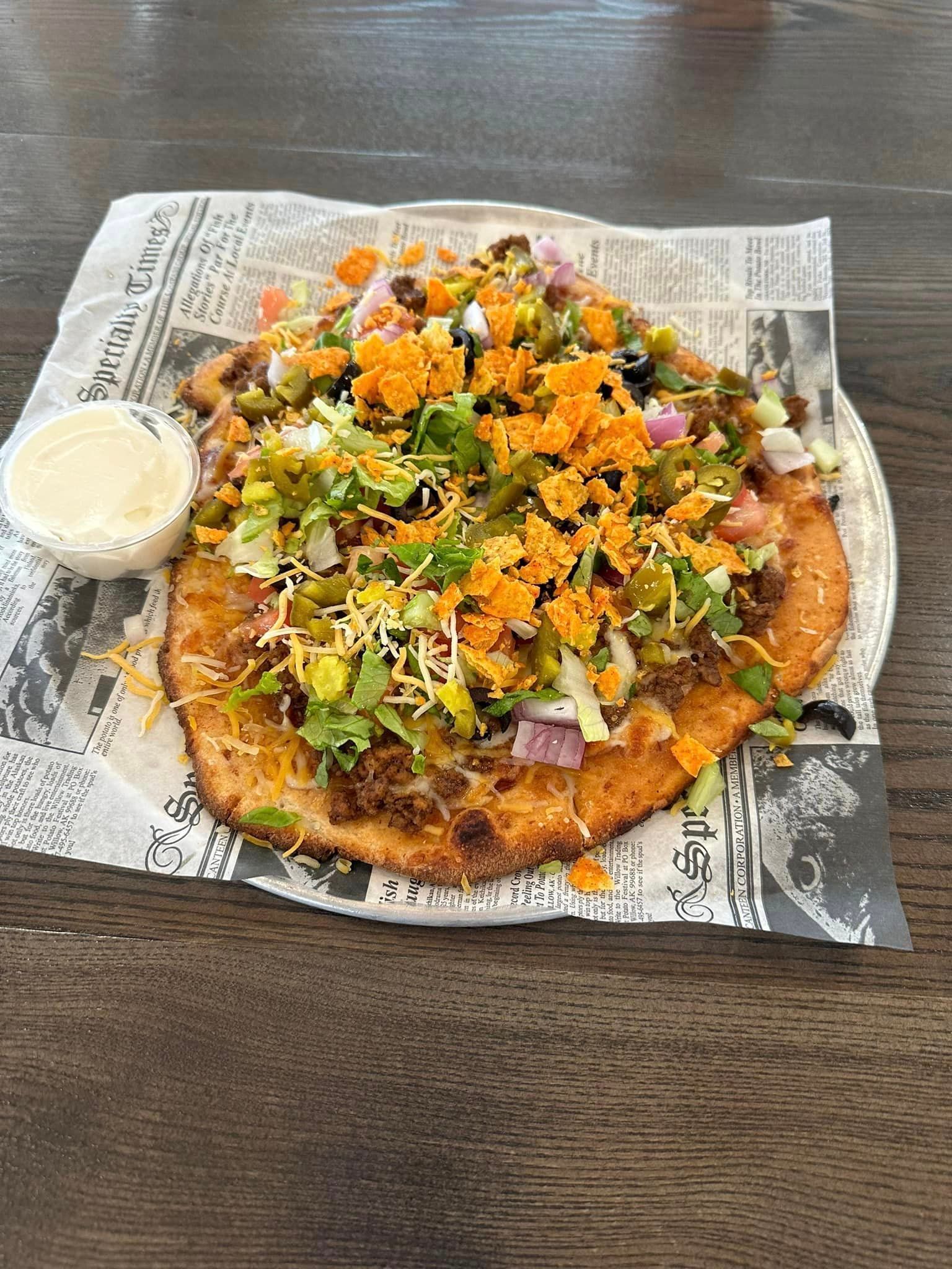 There are many different types of pizzas on display.