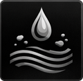 Water droplet falling above water waves.