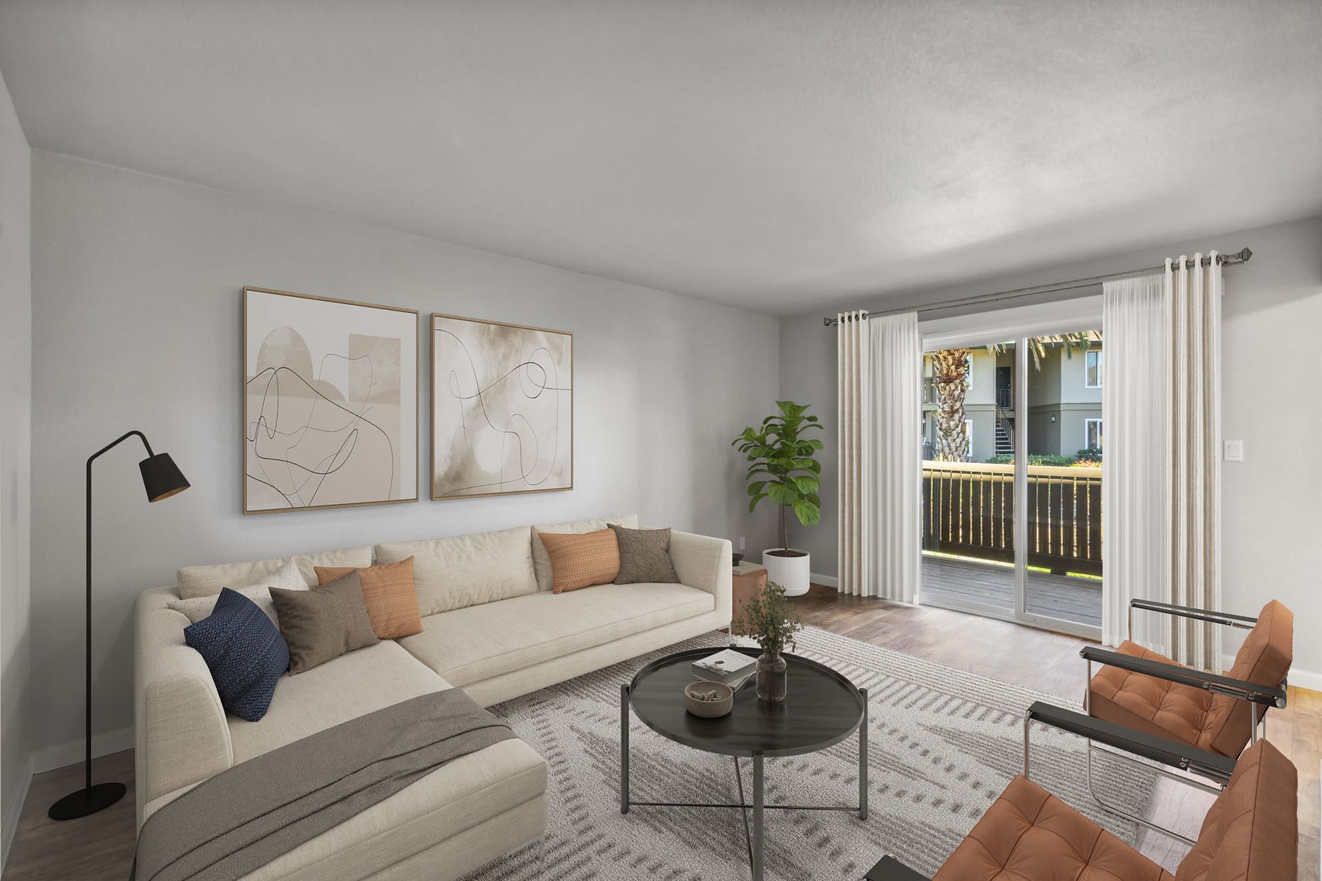 Living room with beige sectional sofa, throw pillows, and sliding glass doors to a balcony.