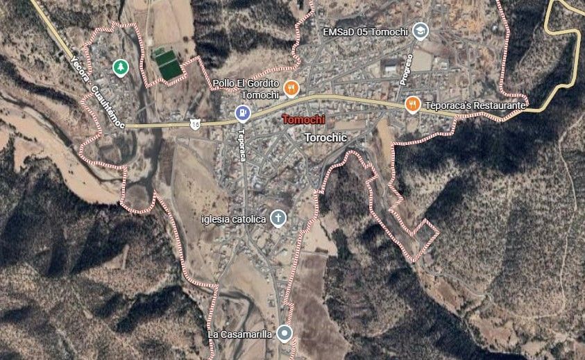 Satellite view of Tepoztlán, Mexico, a town in a valley surrounded by mountains, with roads and buildings visible.