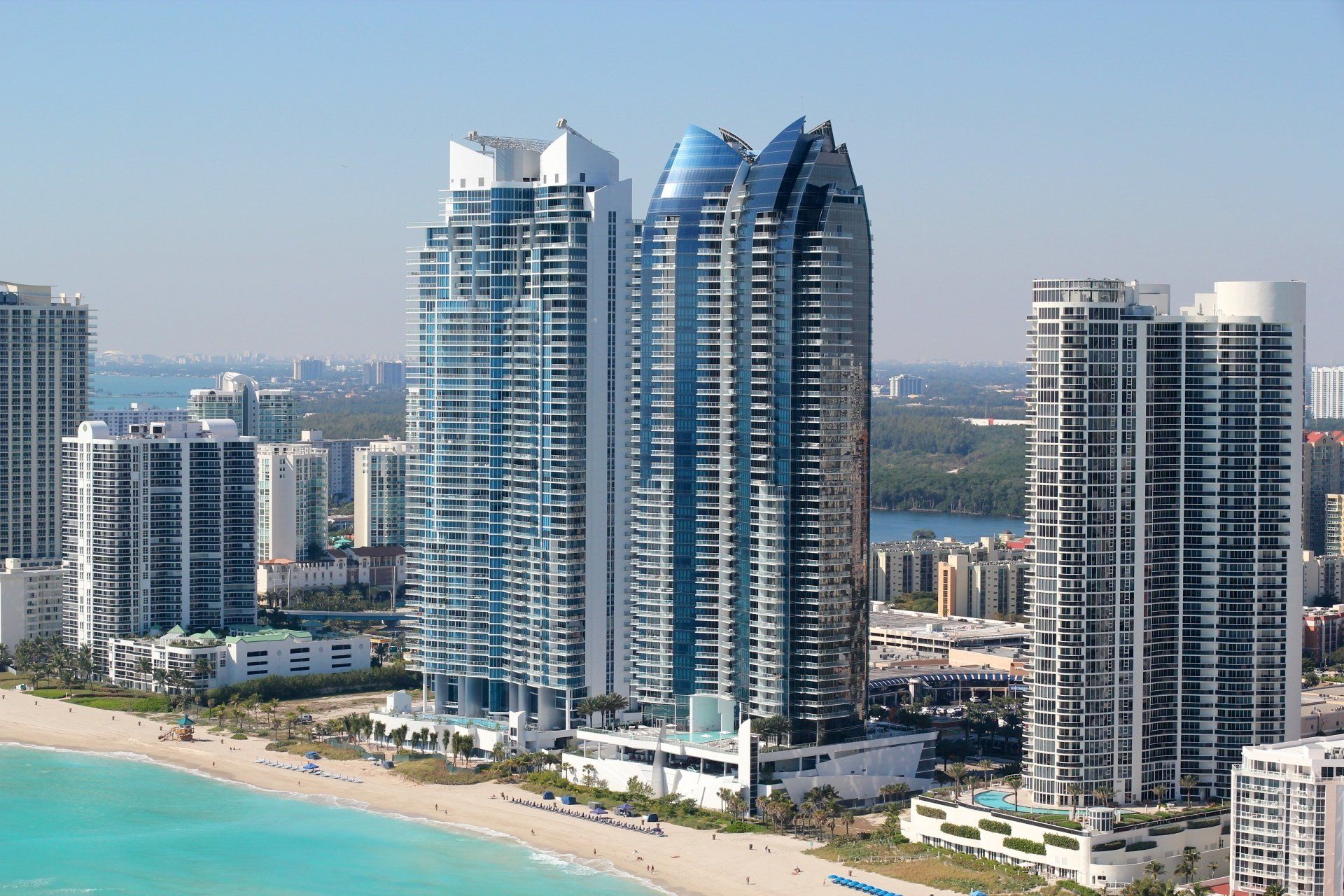 a city skyline with a beach in the foreground
