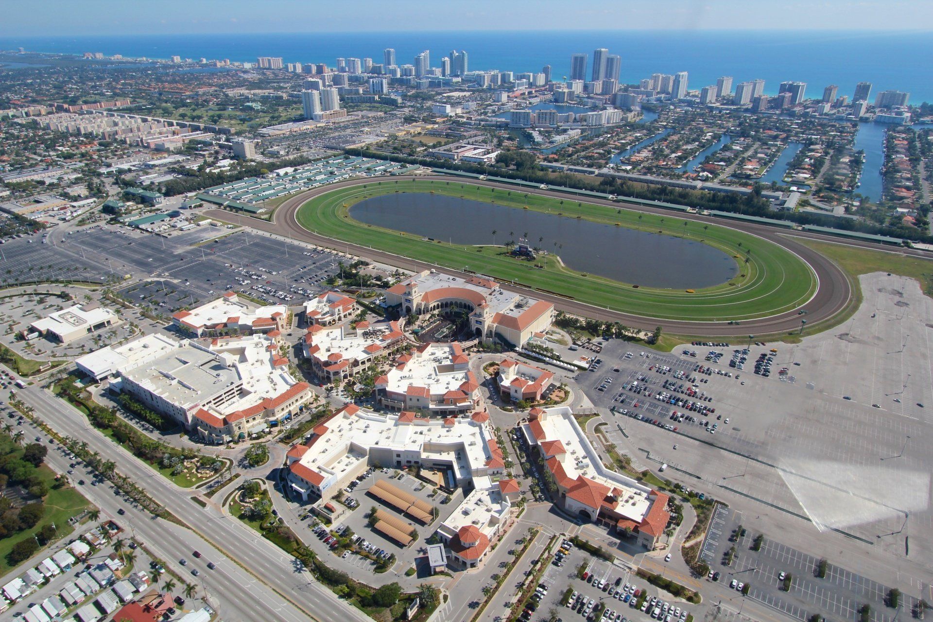 an aerial view of a city with a race track in the middle