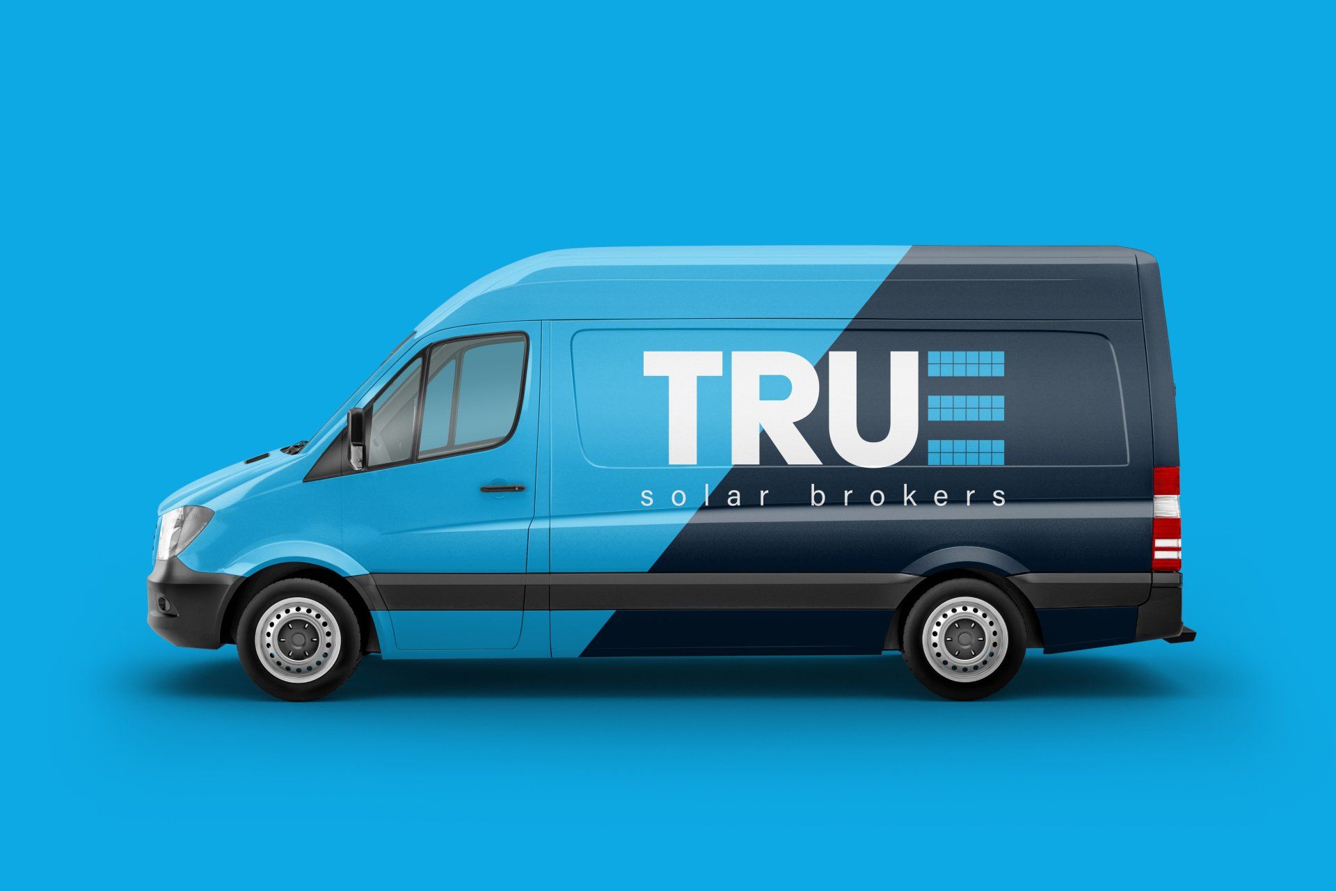 A blue and black van with the word true on it.