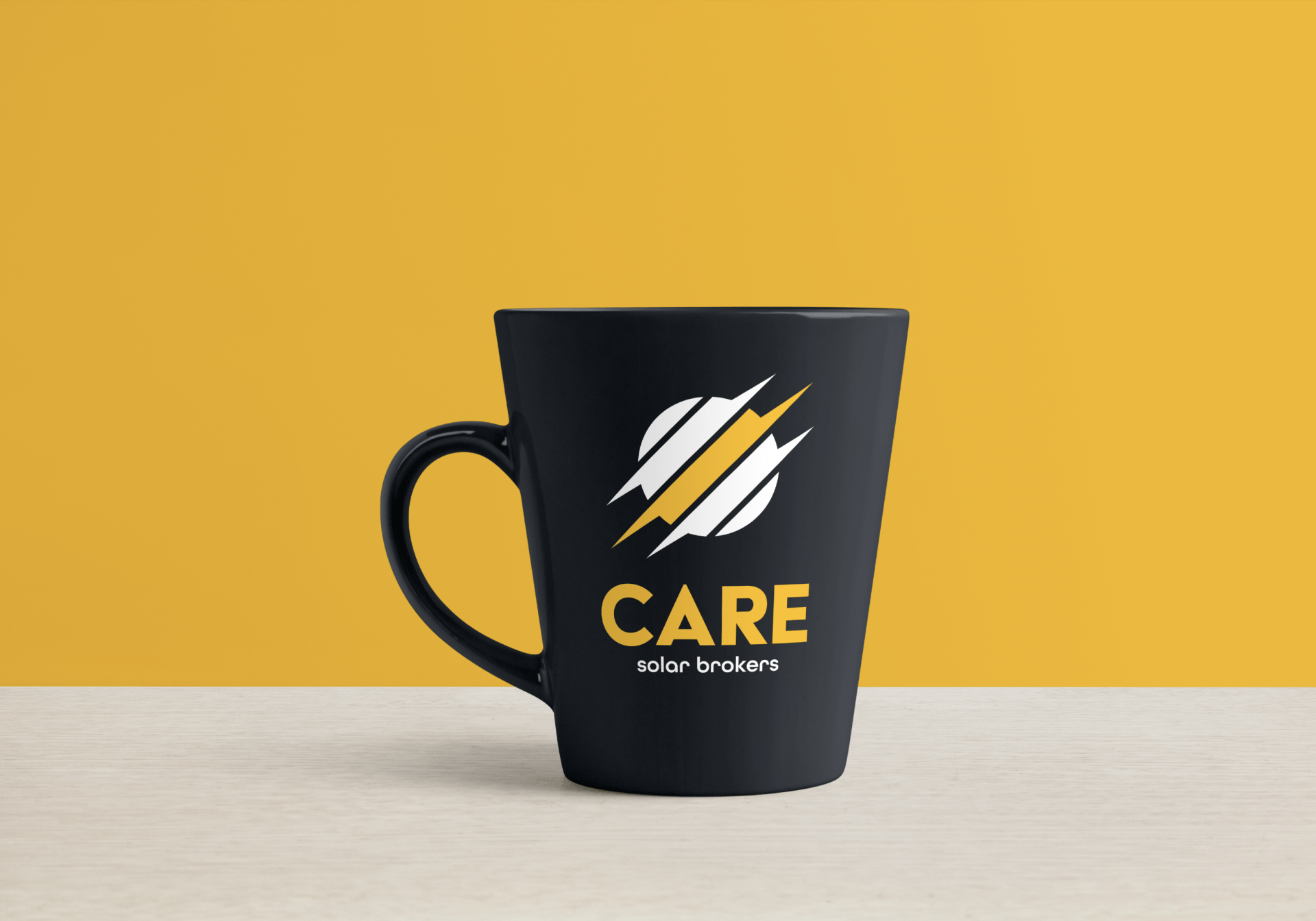 A black coffee mug with the word care on it is sitting on a table.