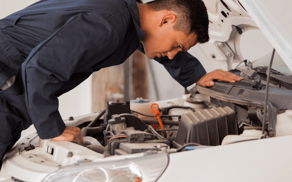 An image of a mobile mechanic doing a pre-purchase inspection.