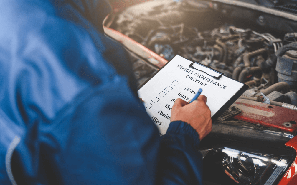 An image of a mobile mechanic performing a car inspection. 