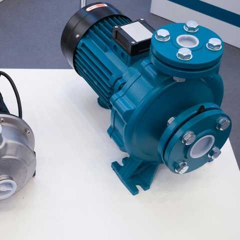 Two electric motorized portable water pumps at hardware store