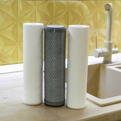 Water filter cartridge for home on background kitchen