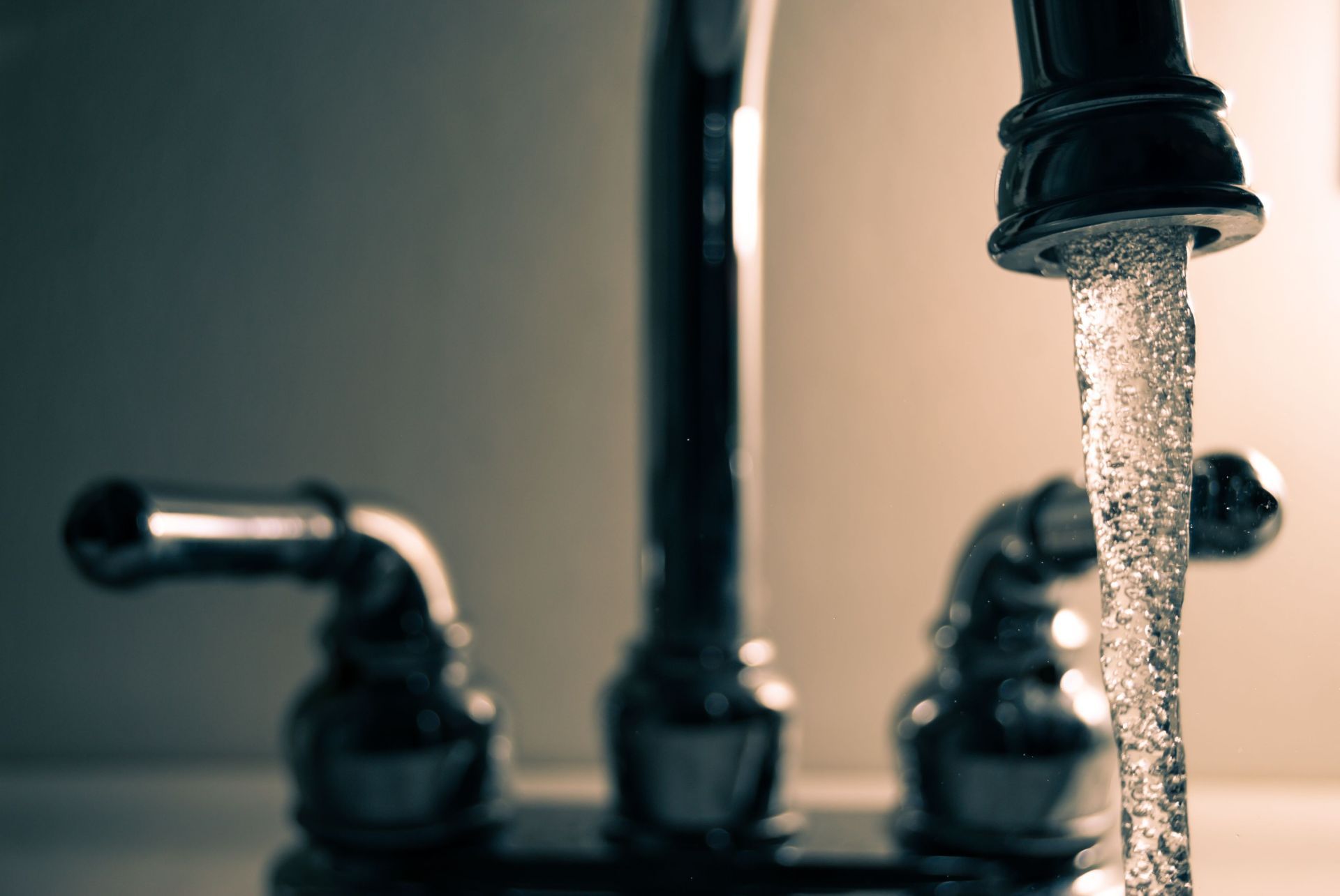 Clean Water Flowing Out of Faucet