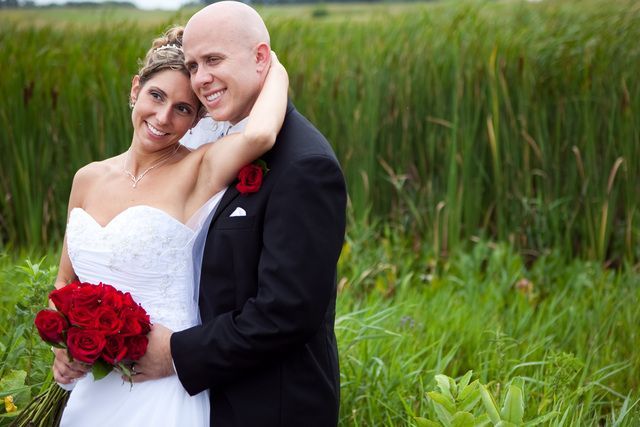 A wedding cake is sitting on top of a table.