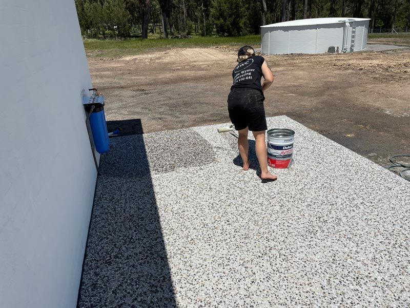 Cleaning Newly Installed Pebble Concrete — Brodie Wynter Concreting in Port Macquarie, NSW