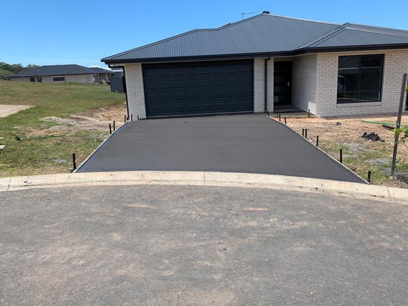 Clean Driveway Concrete Installation — Brodie Wynter Concreting in Port Macquarie, NSW