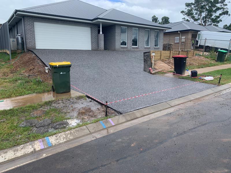 Pebble Driveway — Brodie Wynter Concreting in Port Macquarie, NSW