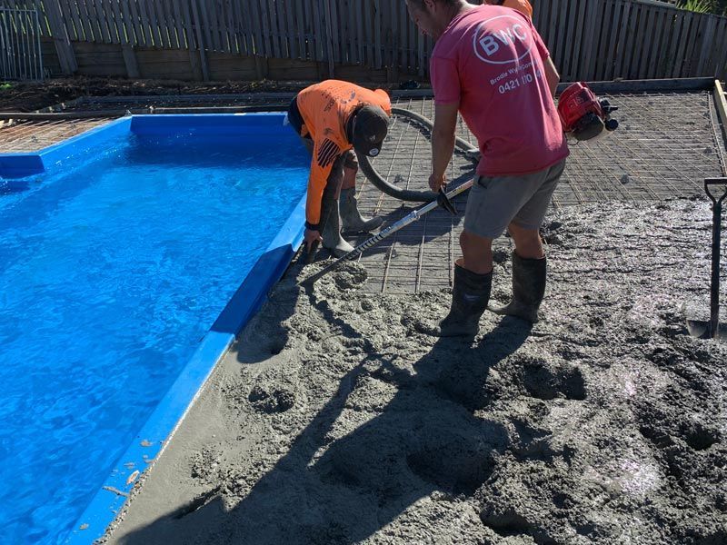 Concrete Installation Beside Pool — Brodie Wynter Concreting in Port Macquarie, NSW