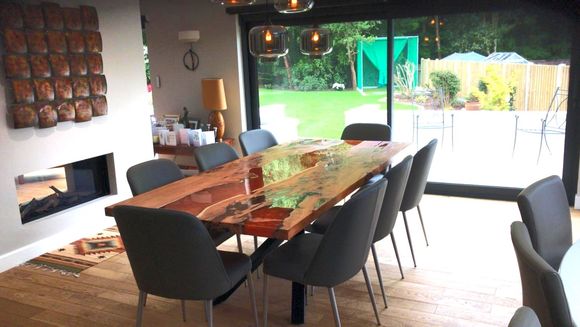 8 seater yew river dining table with copper resin.