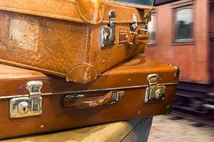 Vintage Suitcases at Train Station -  Luggage Repair in Philadelphia, PA