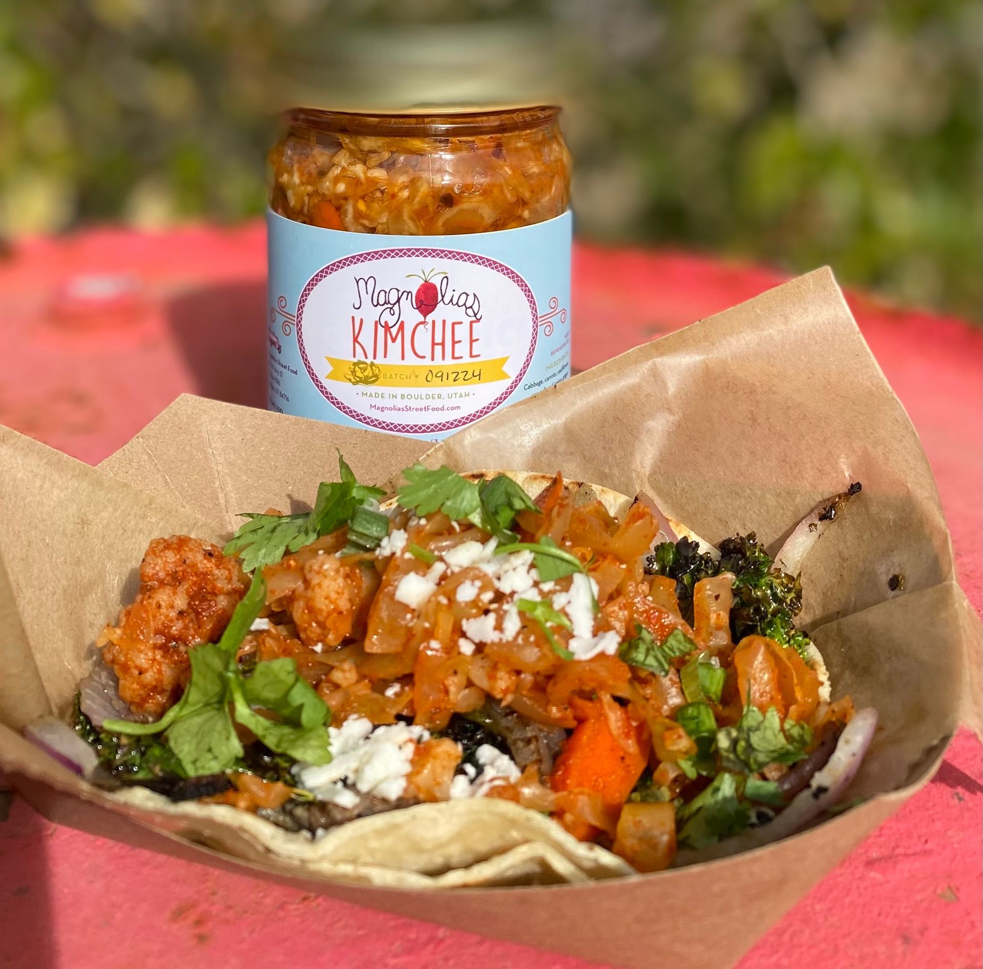 A wooden table topped with a variety of vegetables