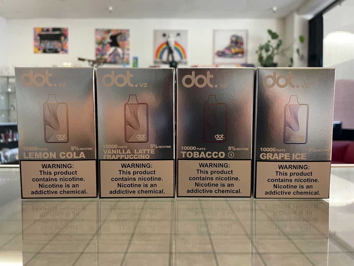 A row of boxes sitting on top of each other on a table.