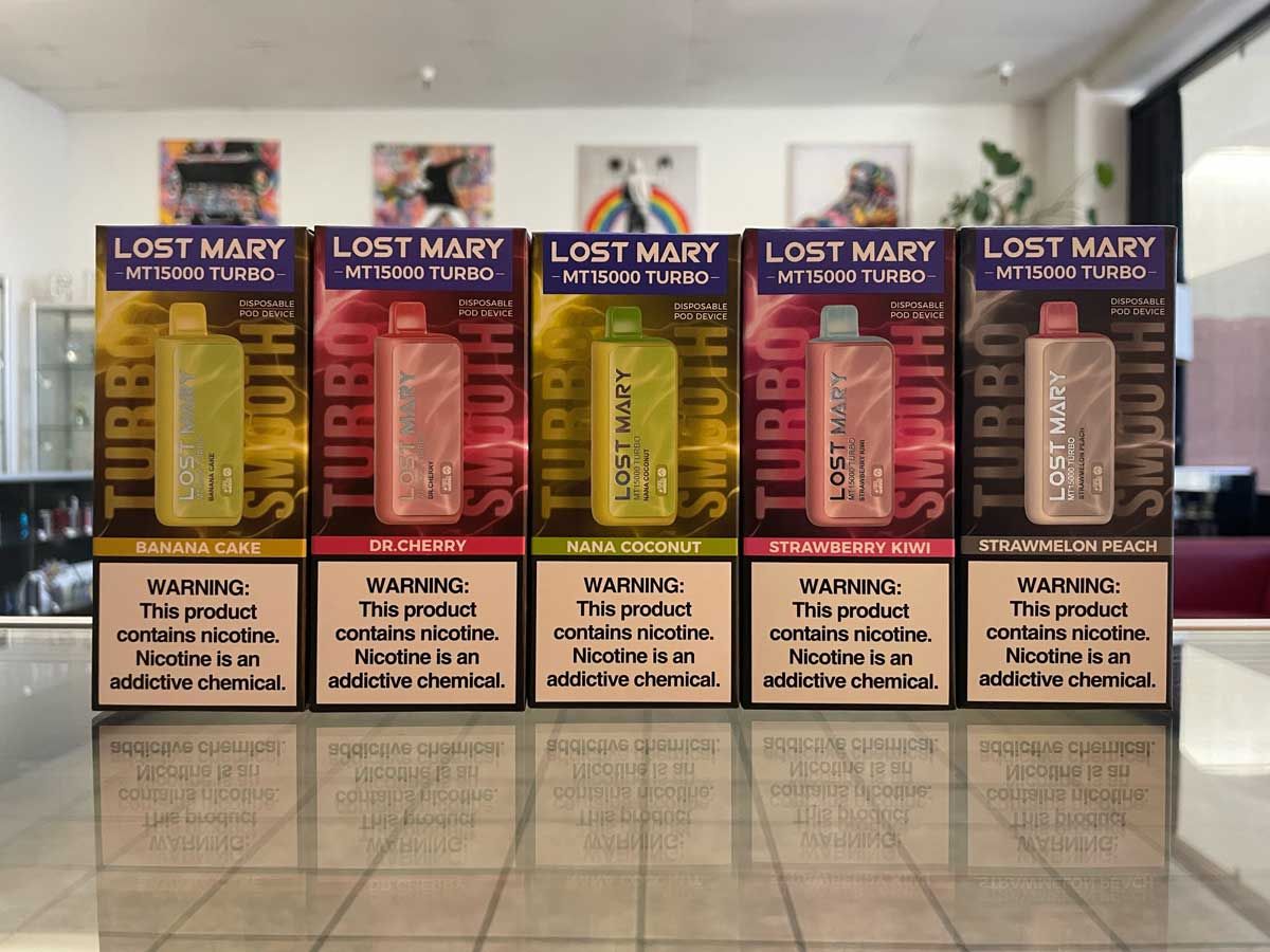 A row of lost mary e liquids are lined up on a tiled floor.