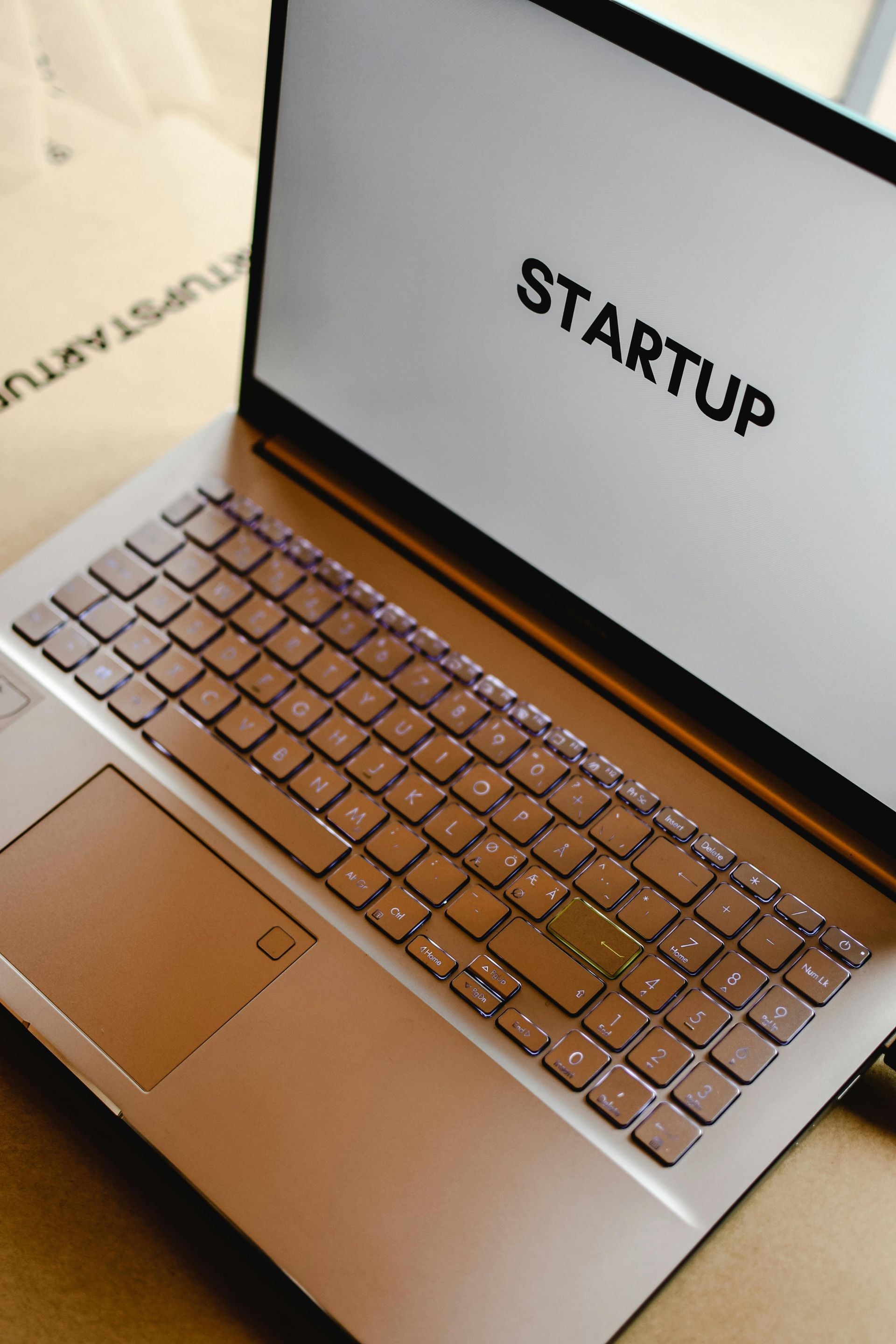 A laptop with the word startup pressure washing on the screen