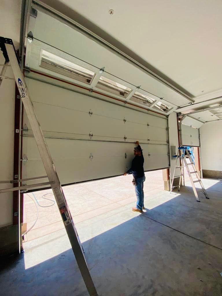 garage door control panel being repaired