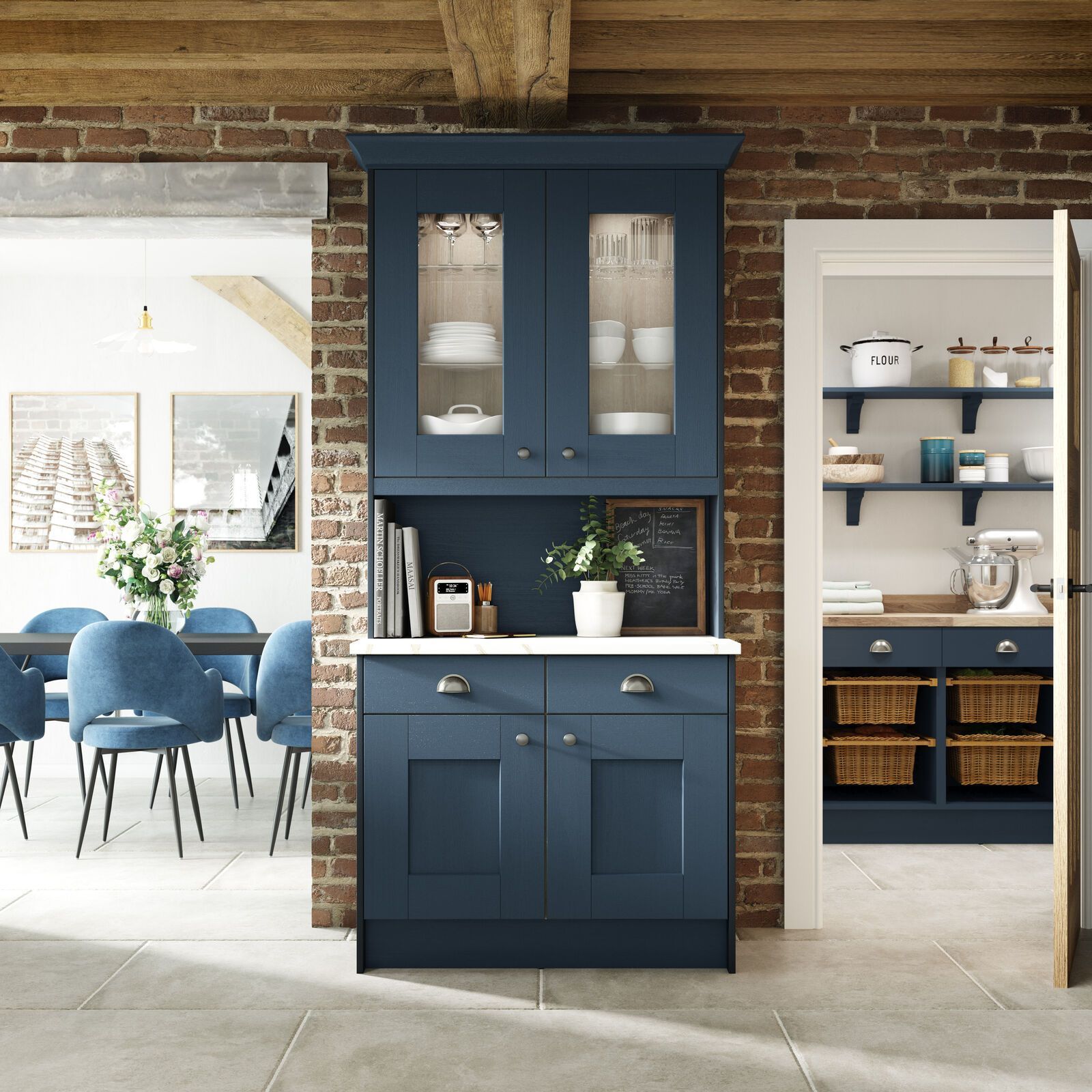A kitchen with blue cabinets and a brick wall