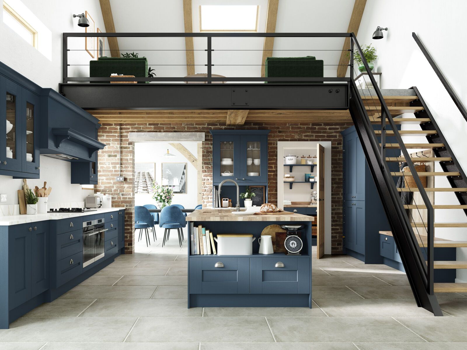 A kitchen with blue cabinets and a staircase leading to the second floor.