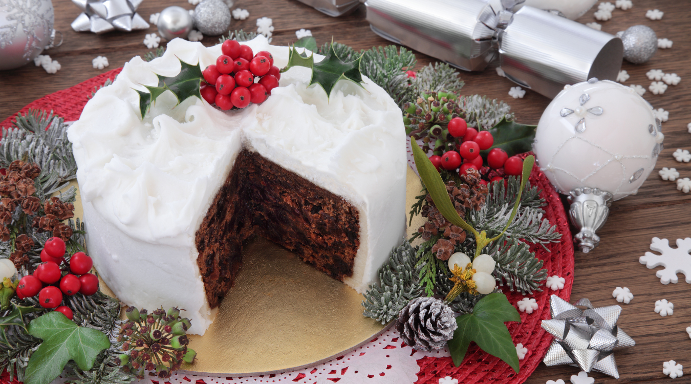 Christmas Cake with white icing and festive decoration A Christmas Cake decorated with festive spirit