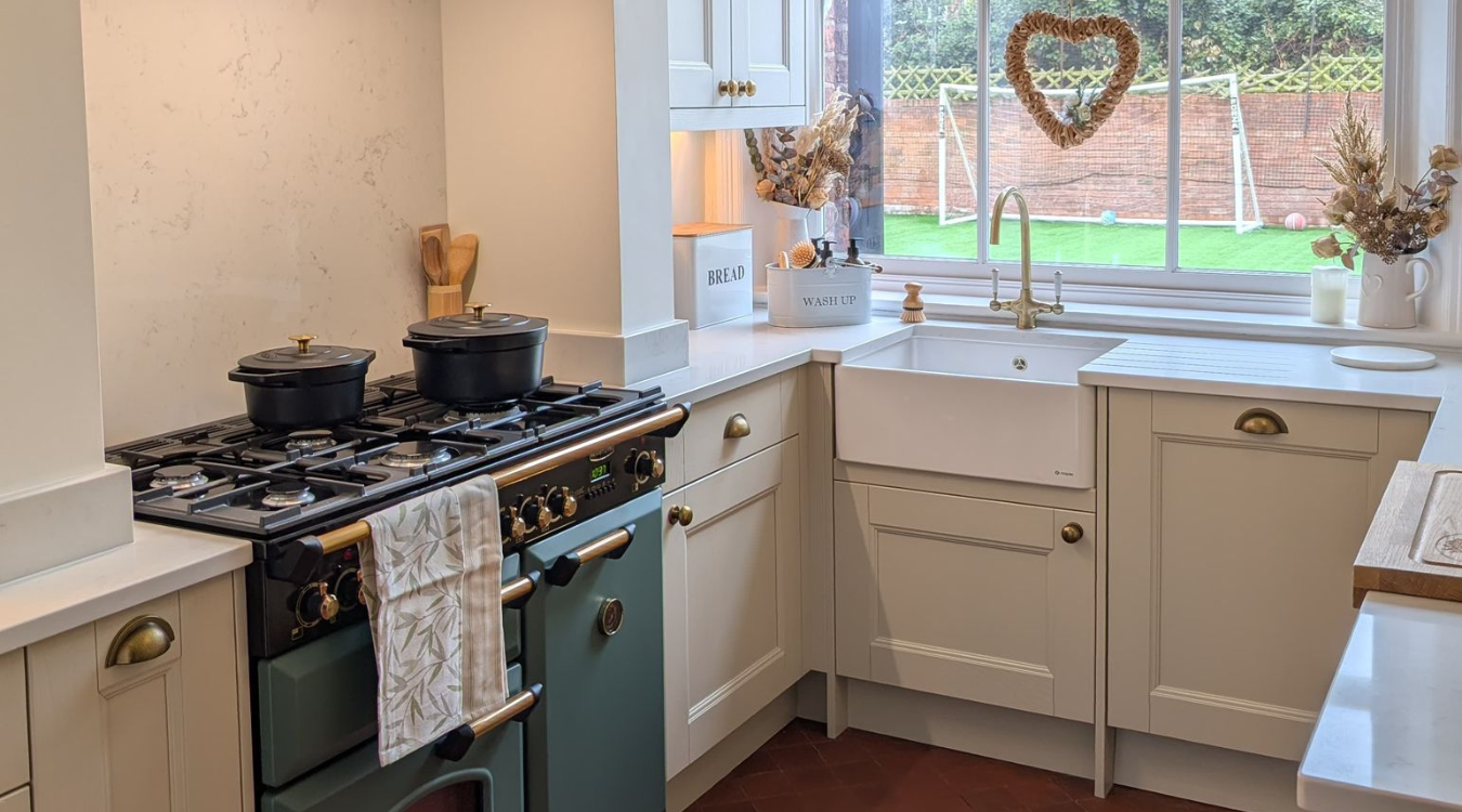 Beautifully designed luxury cosy kitchen with garden view by James James Kitchens