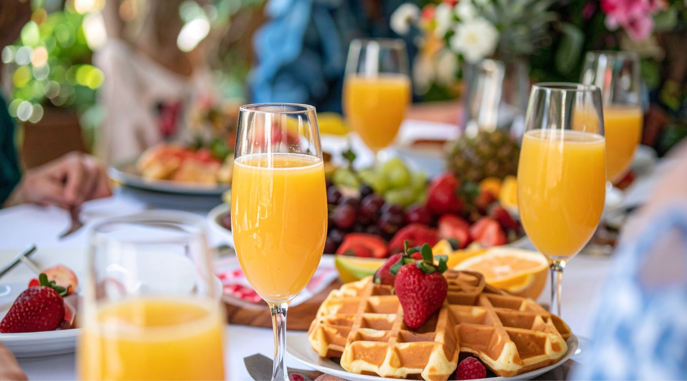 Bucks fizz and a fancy breakfast for Christmas morning laid out on a table Bubbly brunch idea for Christmas breakfast