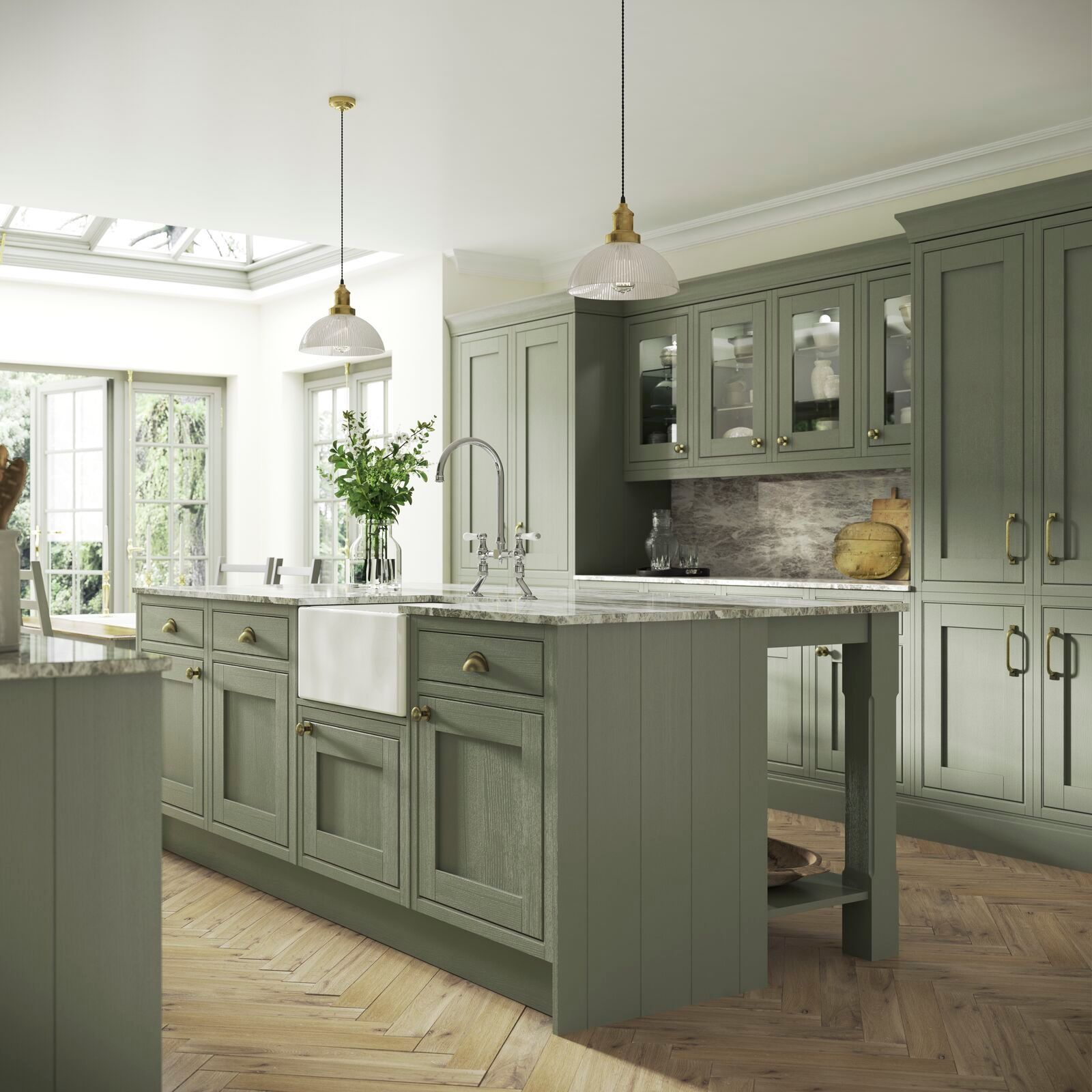 A kitchen with green cabinets and a large island
