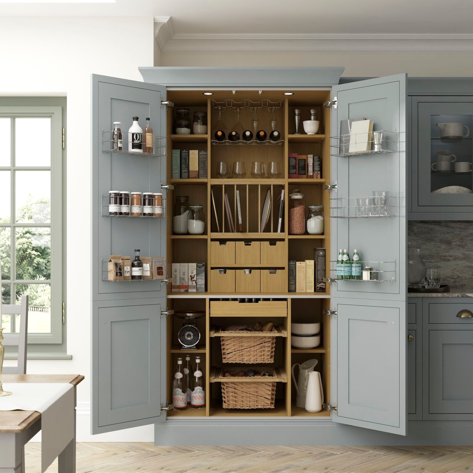 A kitchen with a large pantry with the doors open