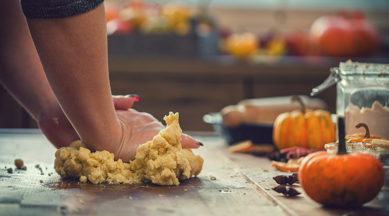 Preparing autumn dishes in the kitchen Someone preparing dough to cook autumn dishes in the kitchen