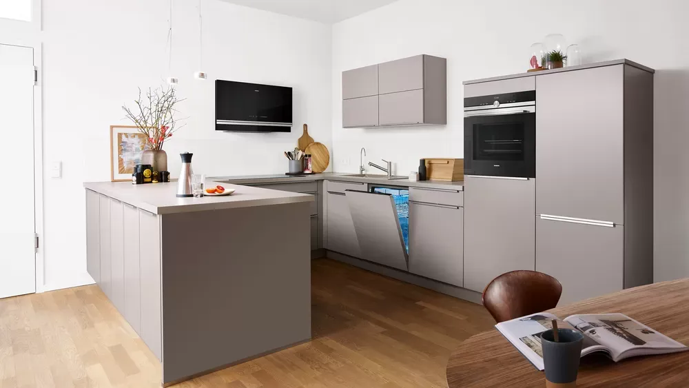 A kitchen with a large island in the middle of the room.