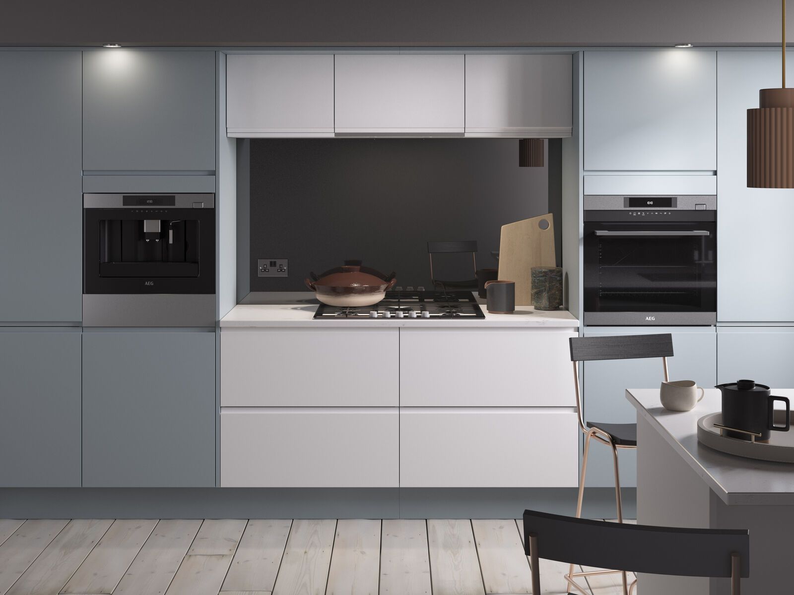 A kitchen with white cabinets and stainless steel appliances