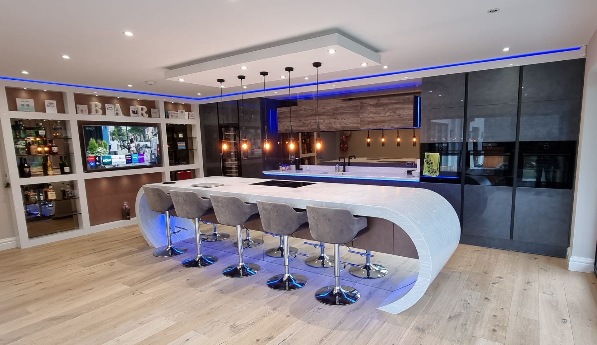 Luxury kitchen design with a unique island feature by James James Kitchens