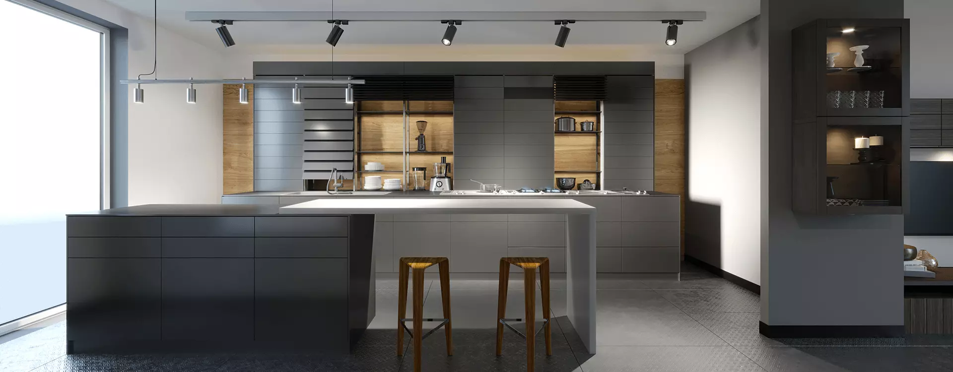 A modern kitchen with a large island and two stools.