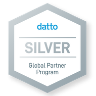 Datto Silver Global Partner Program badge with silver hexagon and blue text.