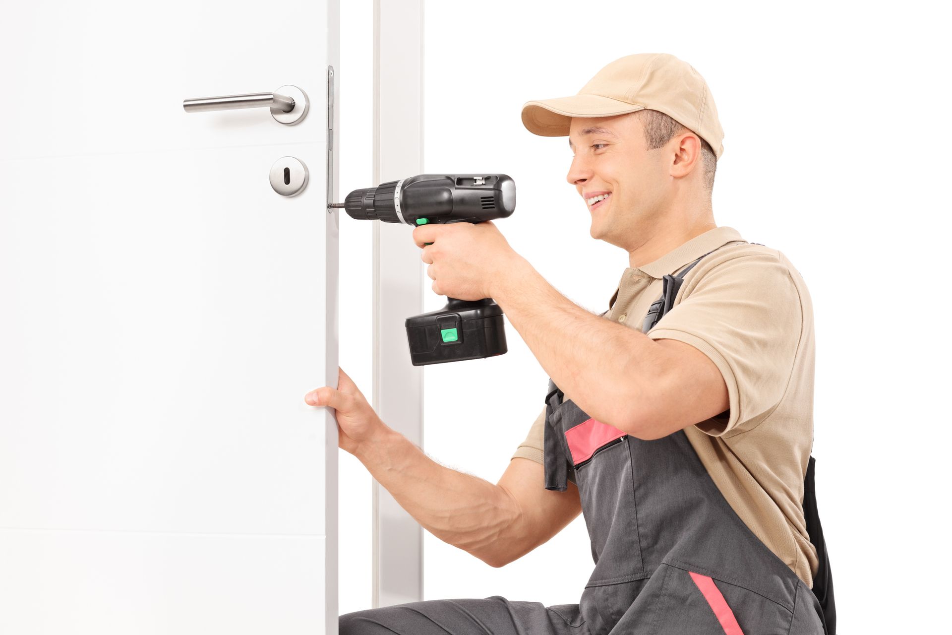 24-hour locksmith screwing a screw on a lock of a door with a drill isolated on white background.