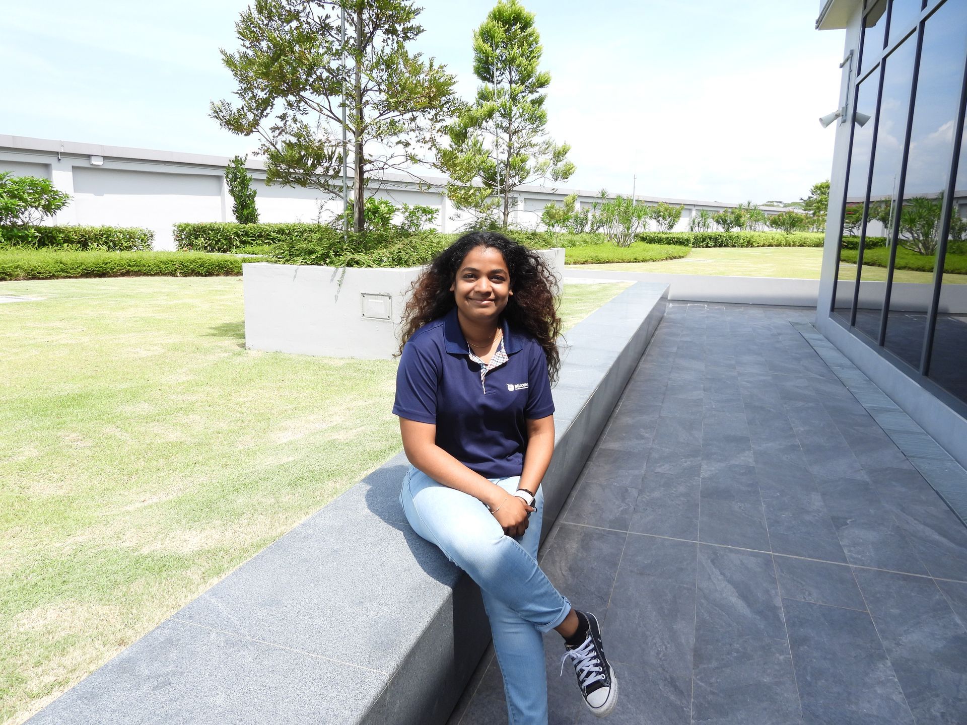 Photo of Karthika on the rooftop garden at Silicon Box HQ