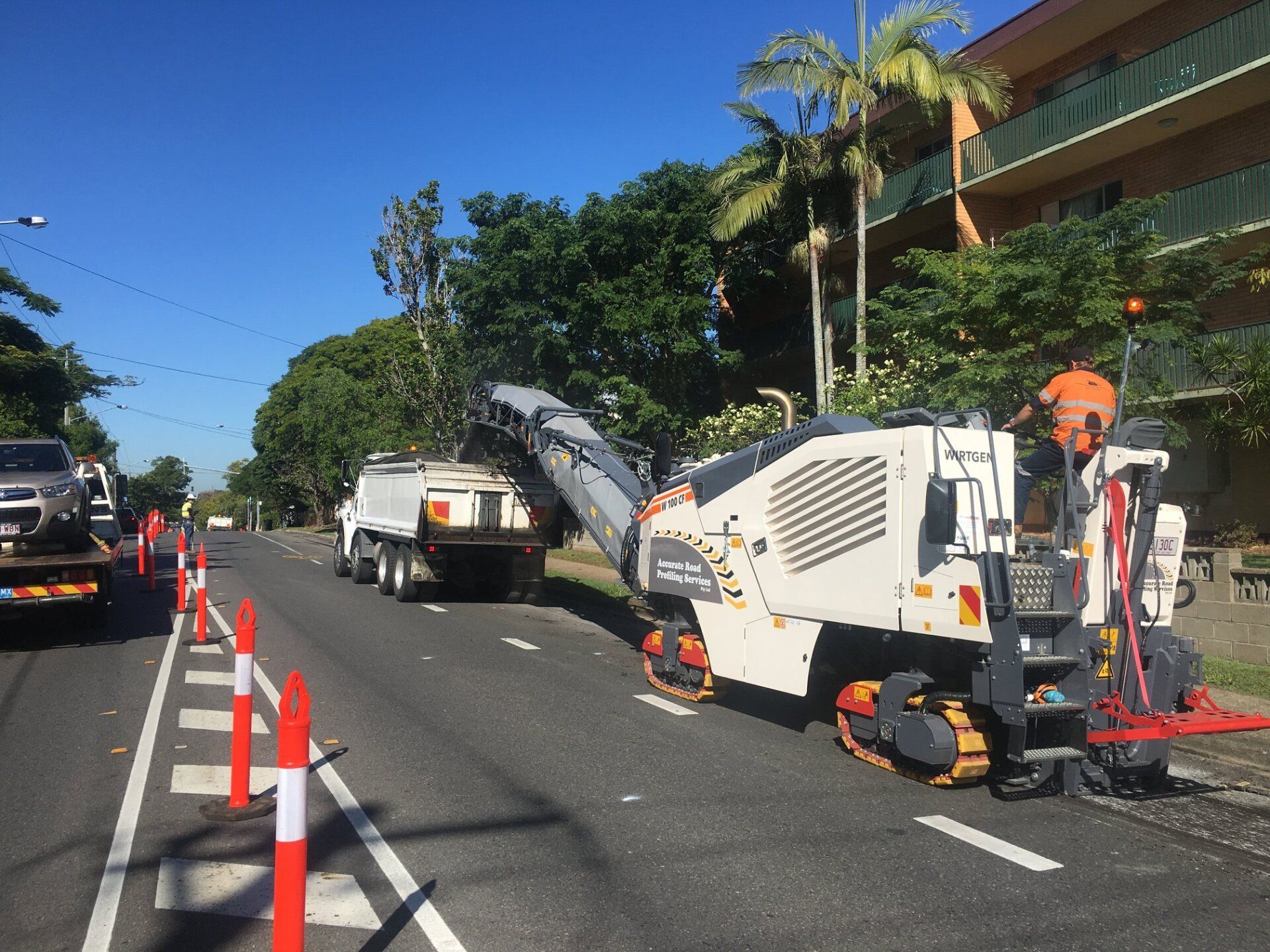 Wirtgen Machine And Truck Removing Asphalt On The Road — Road Profiling in Caboolture, QLD