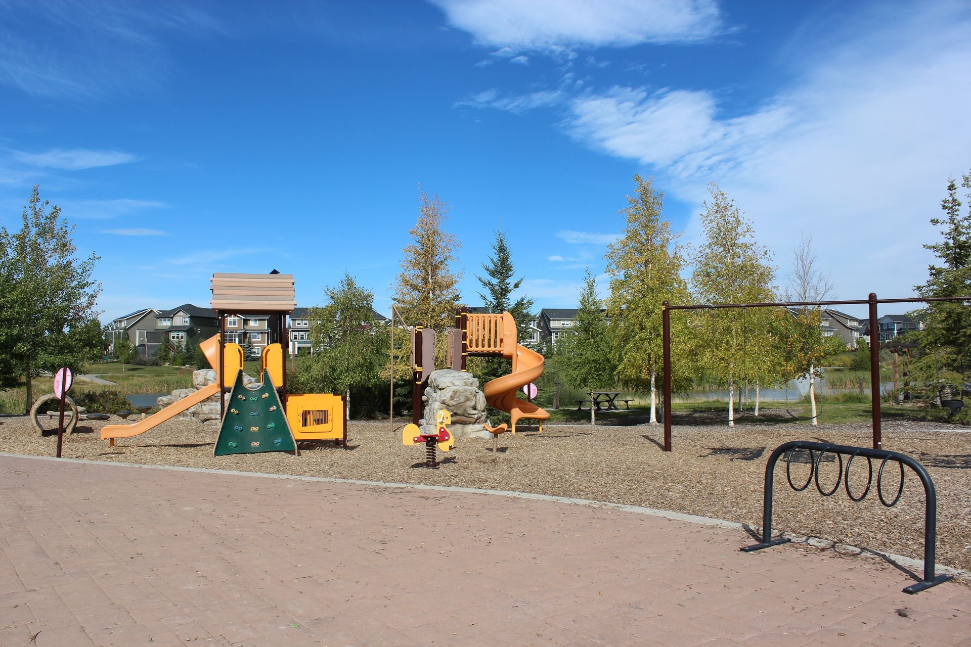 sunset ridge park with swings