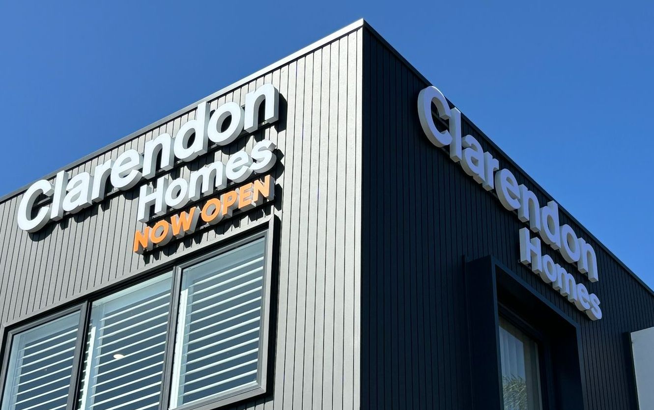 A building with a sign that says clarendon homes on it