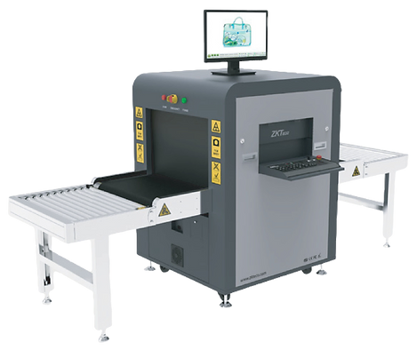 X-ray baggage scanner with conveyor belts and a monitor displaying a scanned bag's contents.