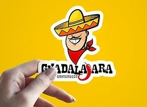 Hand holding Guadalajara restaurant sticker with sombrero-wearing character and chili pepper.