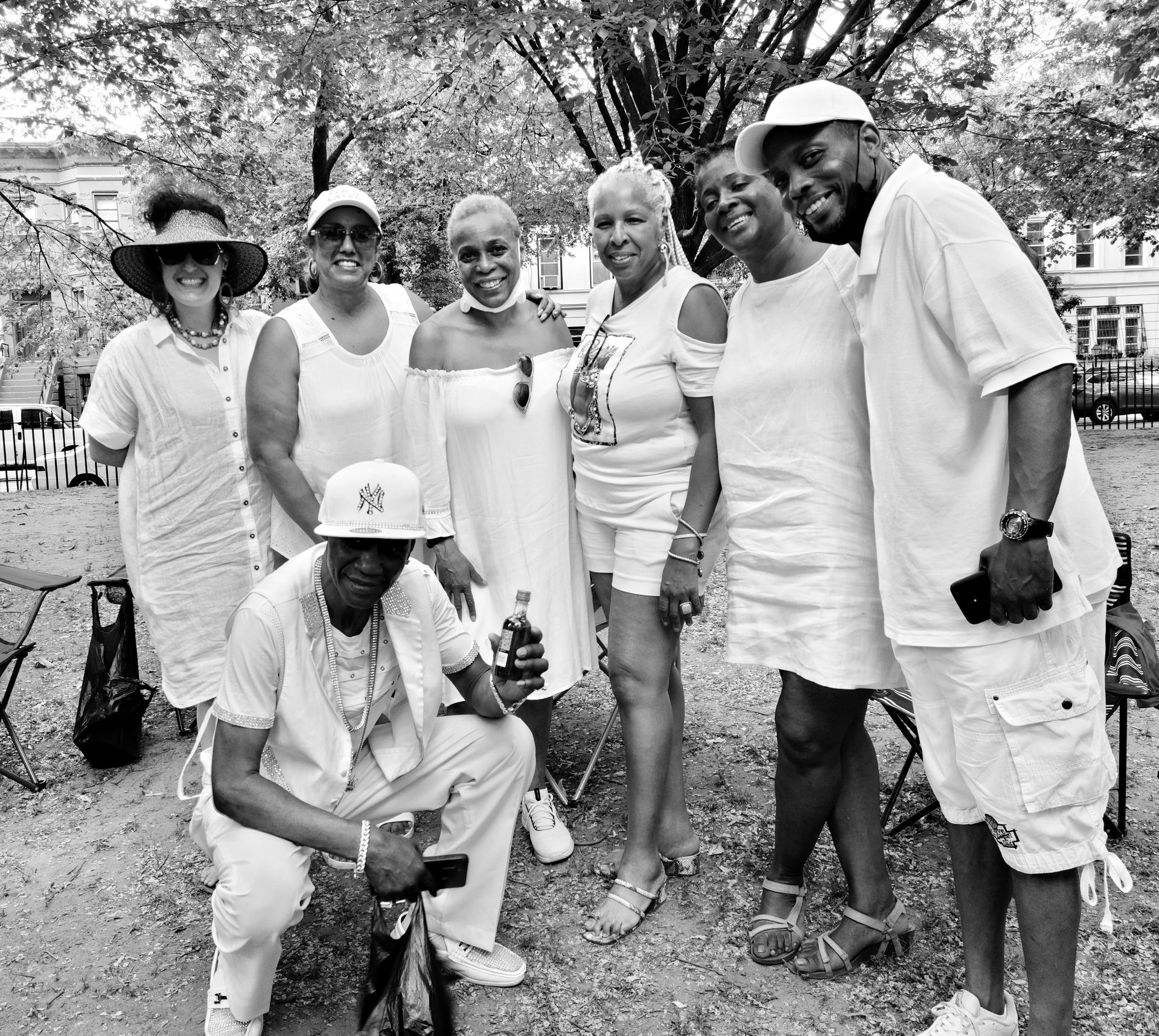 A black and white photo of a group of people posing for a picture.