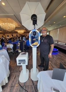 Three photo booths are sitting next to each other in a room.