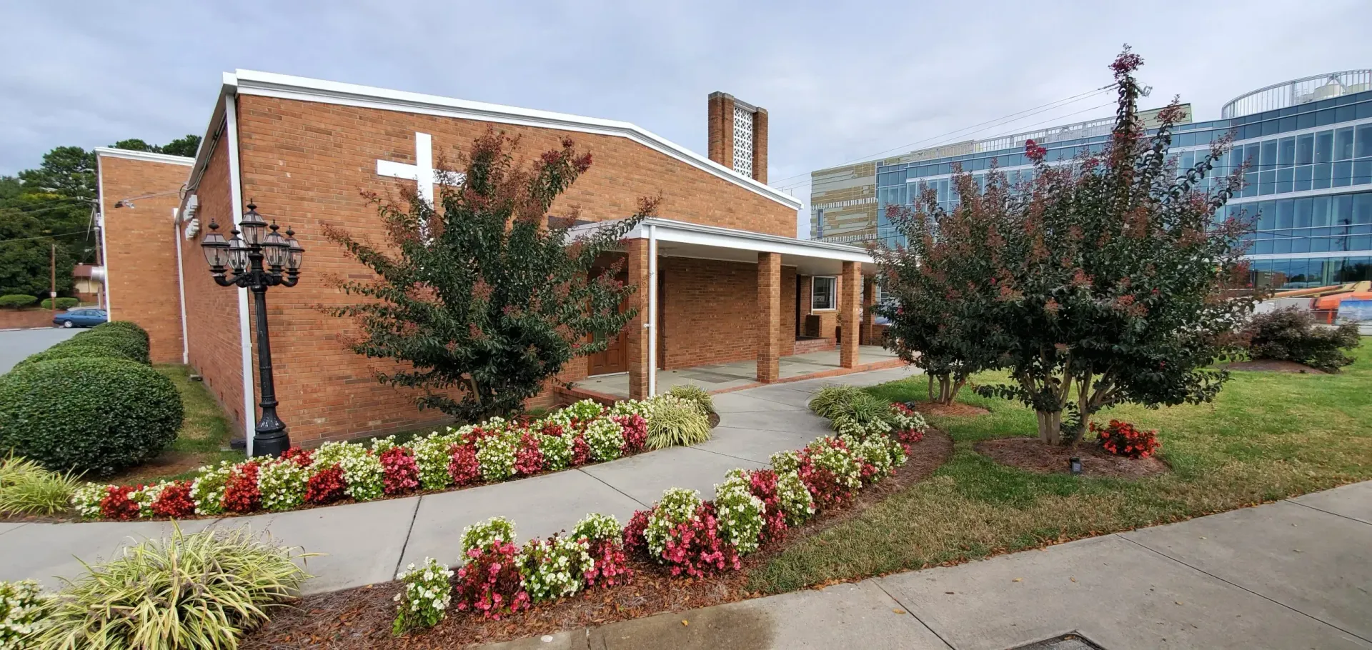 A large office building with a lot of windows on a sunny day.