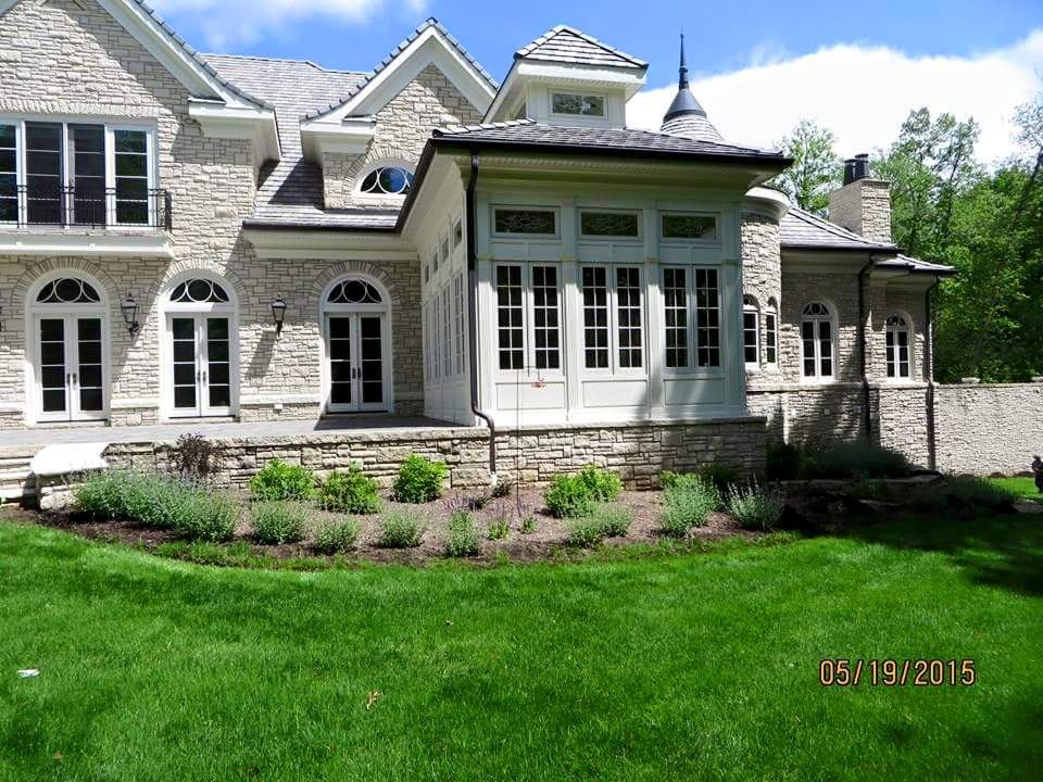 A large brick house with a lot of windows