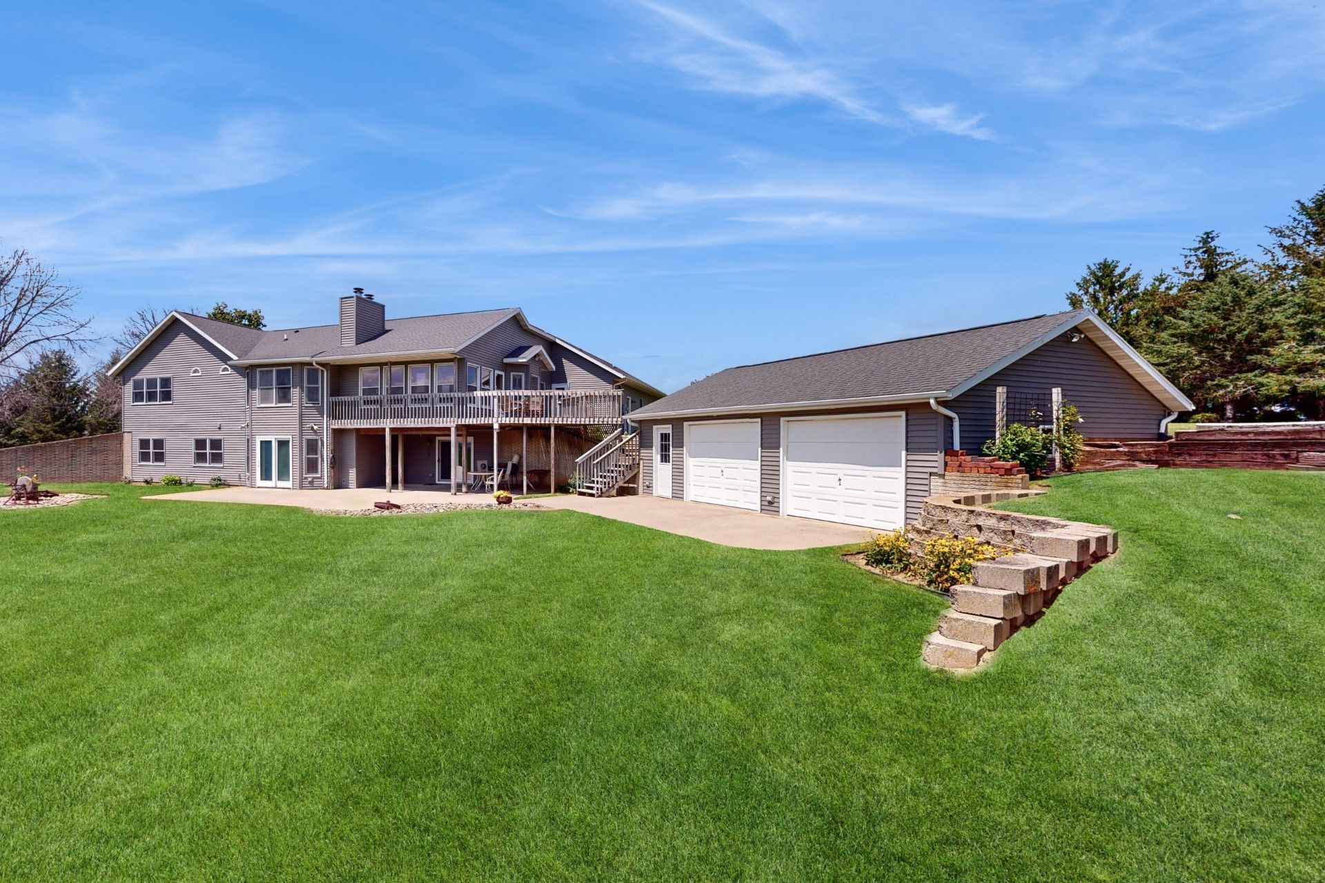 A large house with a large lawn in front of it.